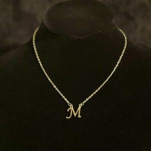 Silver tone necklace with M